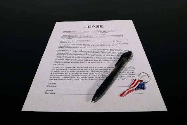 Lease Agreement Document with Pen and Keychain