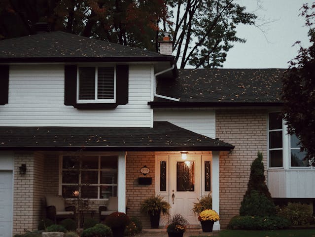 a home exterior at night with outdoor lighting