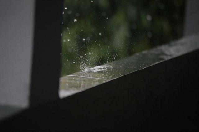 hail hitting a windowsill