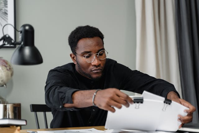 A person looking through documents